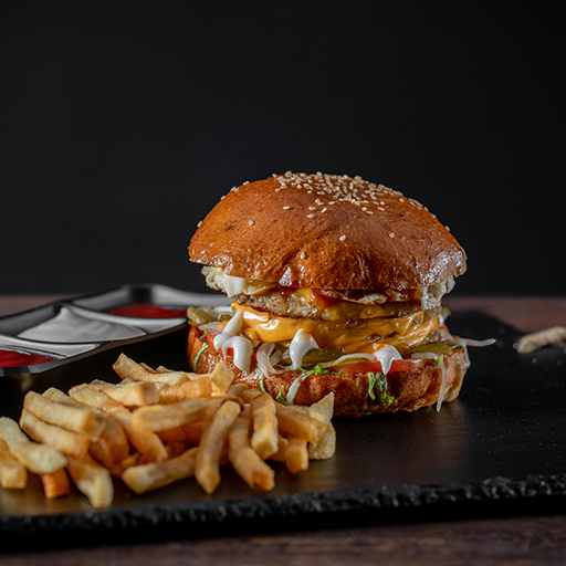 Gourmet cheeseburger with fresh veggies