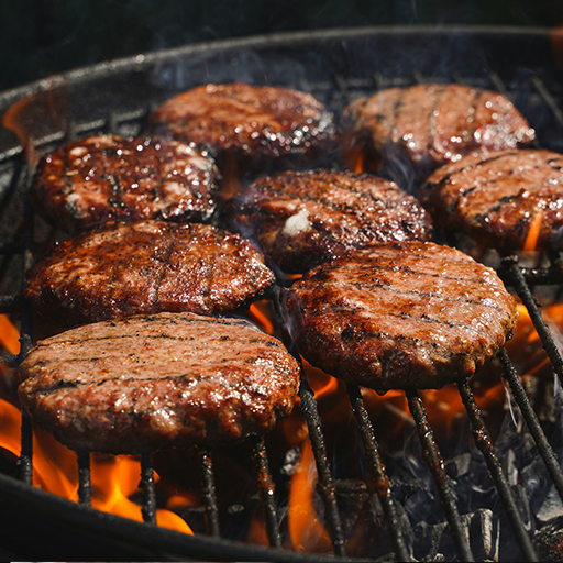 Close up of a smashed burger patty on a hot grill